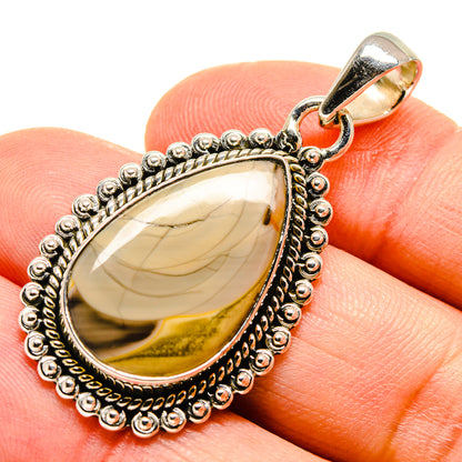 Sterling silver teardrop jasper pendant with textured bead border and gold-toned back