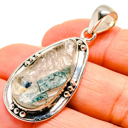 Green quartz crystal pendant in sterling silver teardrop bezel with bail, close-up