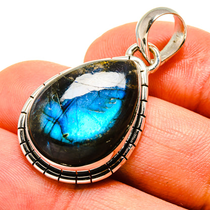 Labradorite pendant in oval 925 sterling silver bezel with blue flash and bail loop.
