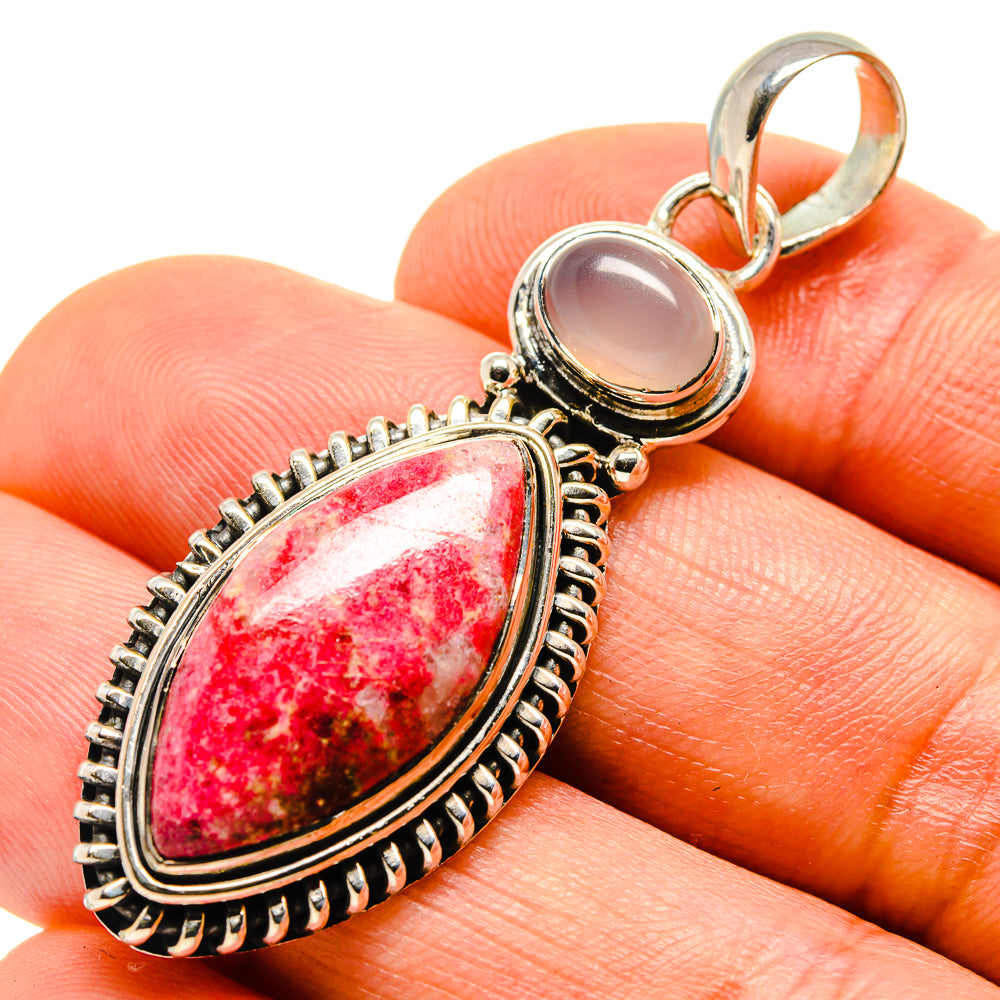 Sterling silver teardrop pendant with red pink stone and pale stone, ornate bezel