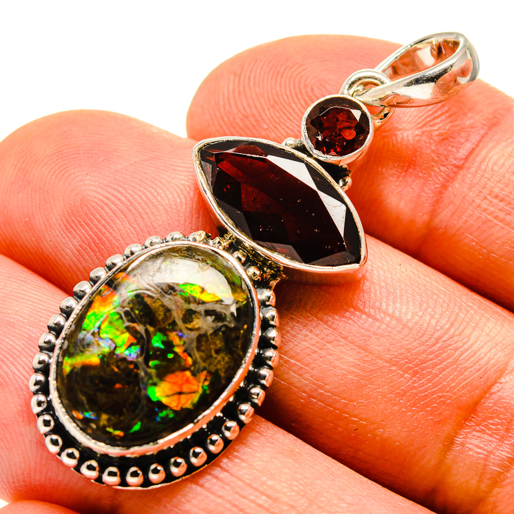 Iridescent ammolite and red garnet sterling silver pendant with marquise and round stones
