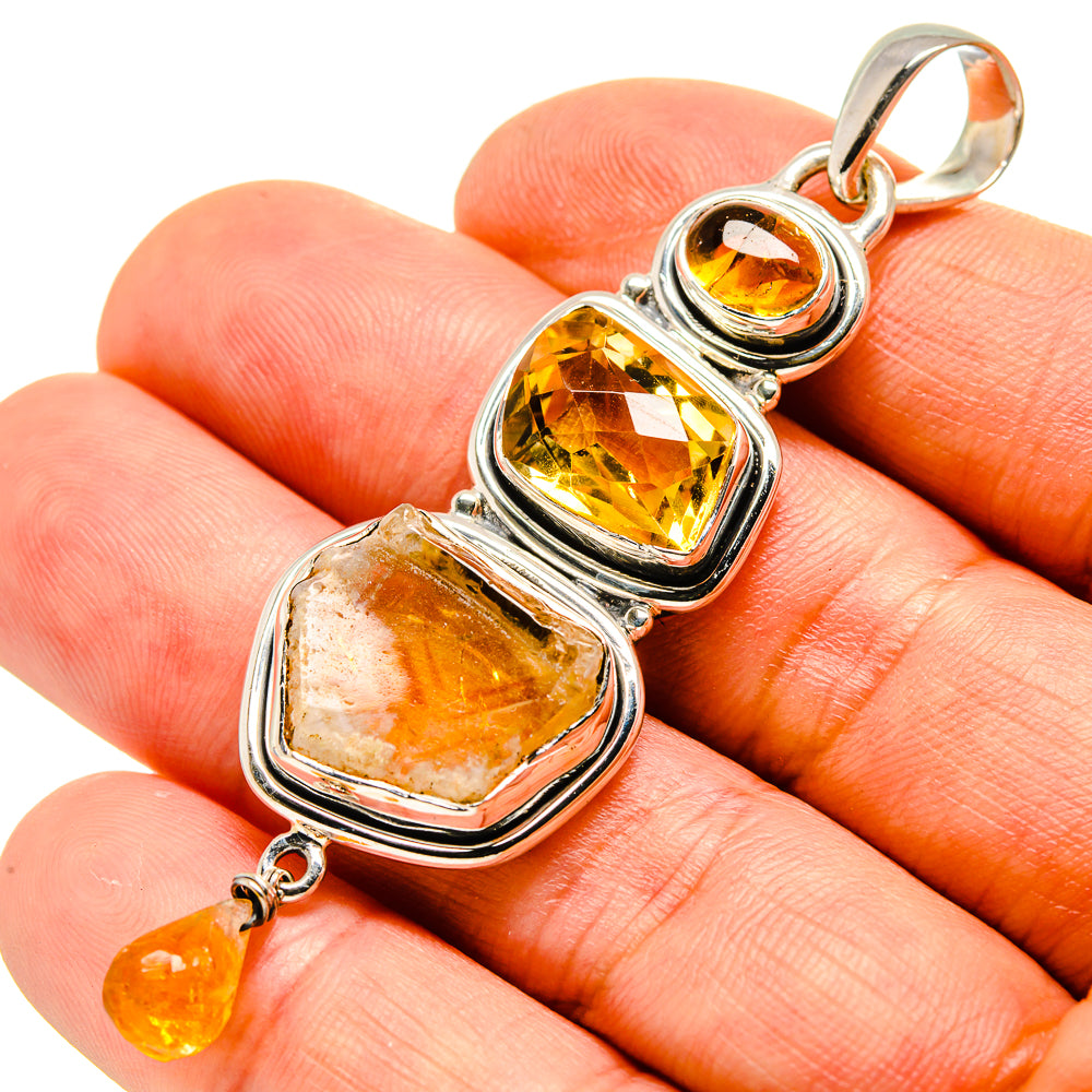 Rough citrine pendant in polished 925 sterling silver with amber yellow stones
