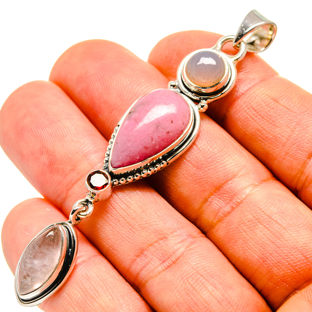 Sterling silver pendant with pink teardrop rhodonite and linked oval stones, loop bail