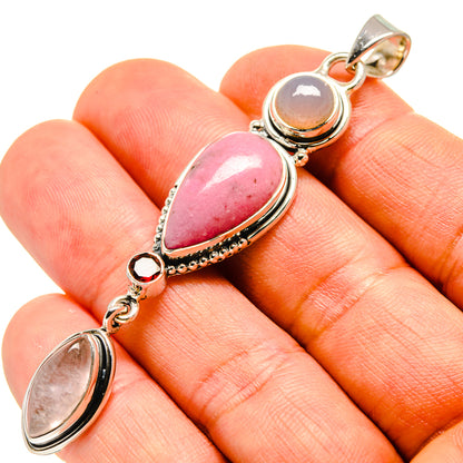 Sterling silver pendant with pink teardrop rhodonite and linked oval stones, loop bail