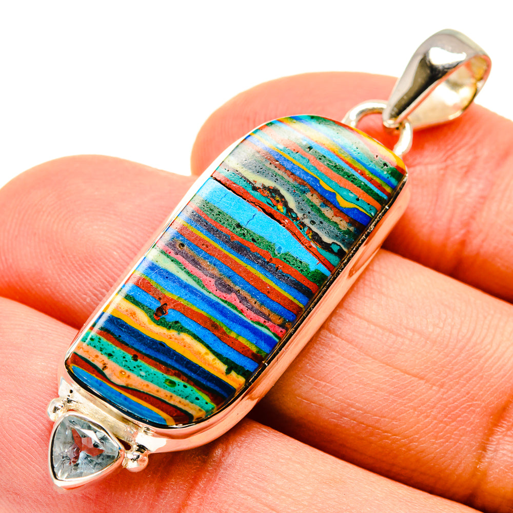 Rainbow calsilica pendant with blue topaz accent in 925 sterling silver setting