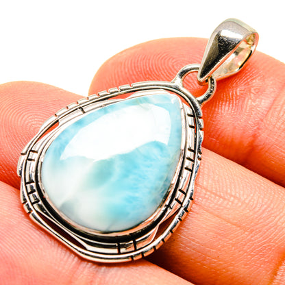 Larimar pendant in teardrop blue stone with sterling silver ornate frame and bail
