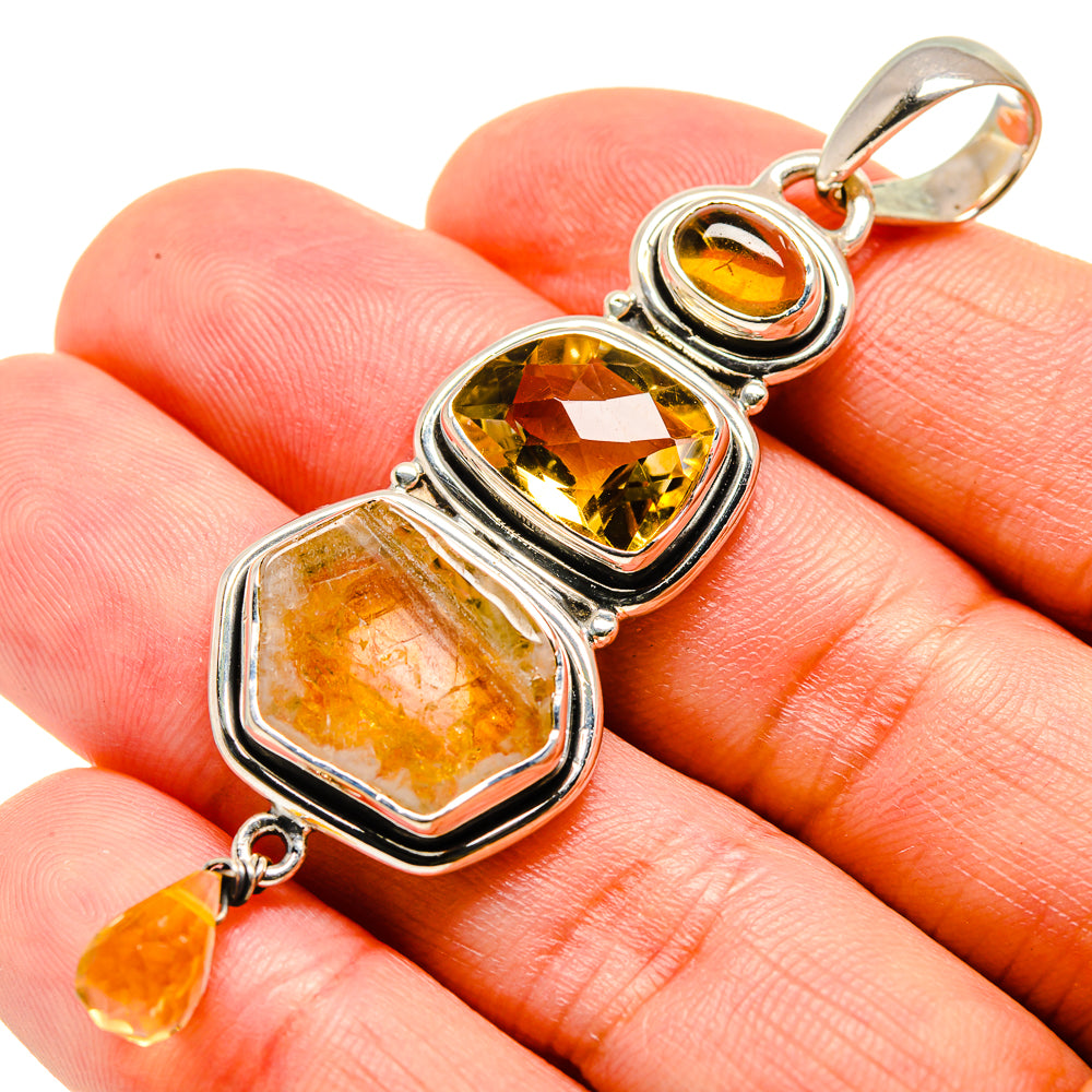 Sterling silver citrine pendant with rough and faceted yellow gemstone accents