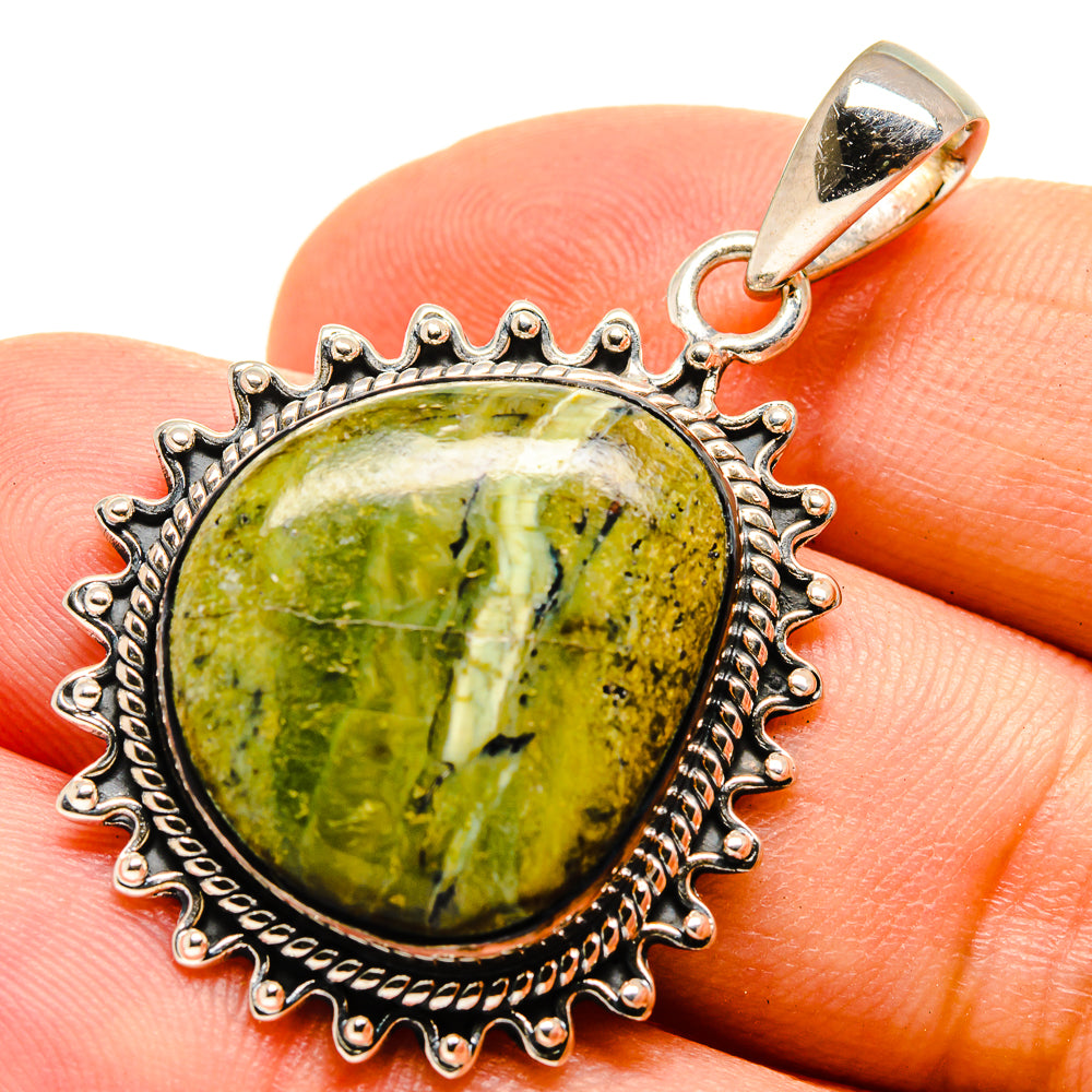 African green opal pendant in oval cabochon with ornate silver bezel and bail