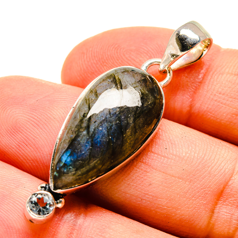 Close-up oval labradorite pendant with quartz accent in 925 sterling silver