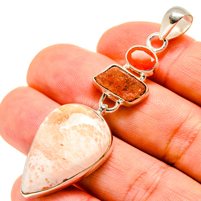 Sterling silver gemstone pendant with teardrop, rectangular, and round orange stones