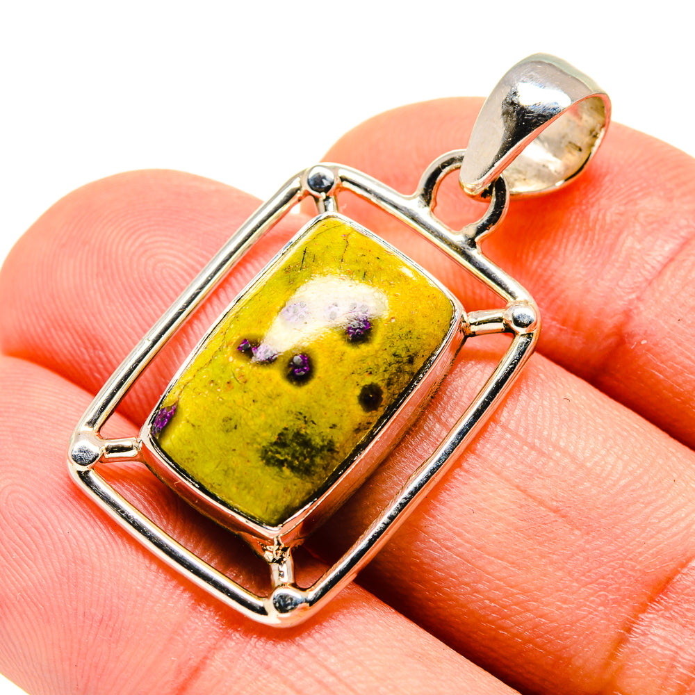 Sterling silver pendant featuring rectangular yellow stone with purple speckles, bail top