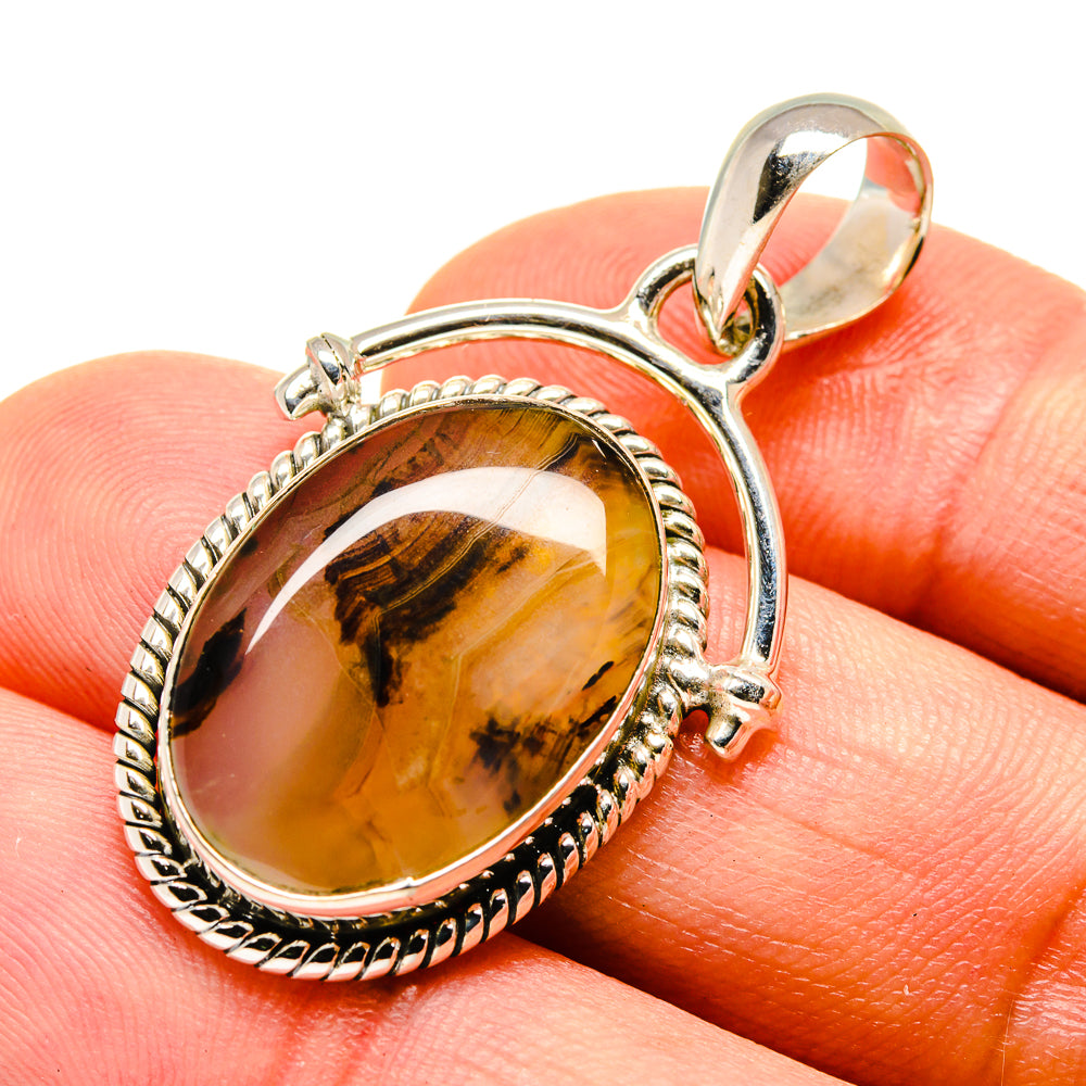 Montana agate pendant with oval amber-gold cabochon and rope-edged silver frame