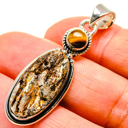 Sterling silver tiger eye pendant with oval rough stone and rope-texture bezel