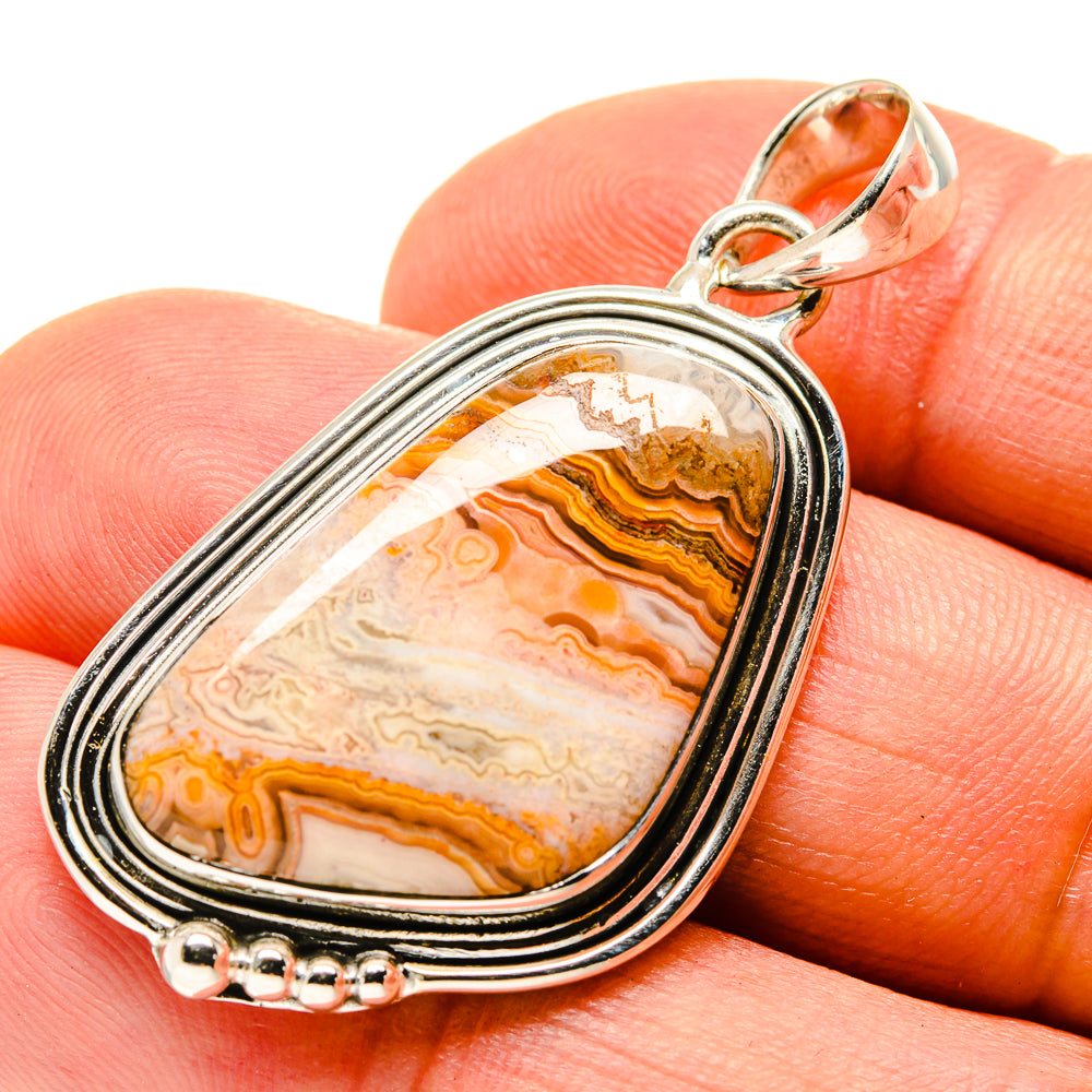 Sterling silver lace agate pendant with orange, cream and black striped stone