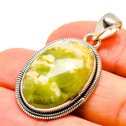 Oval green opal pendant in 925 sterling silver bezel with bail loop close-up