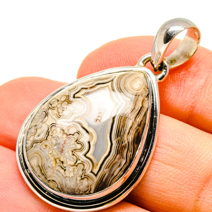 Teardrop sterling silver pendant with lace agate stone, beige, tan, and dark brown banding.