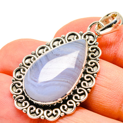 Teardrop blue lace agate pendant with ornate sterling silver bezel and loop bail