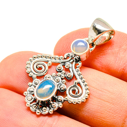 Sterling silver opal pendant close-up with two oval blue cabochons and top bail loop