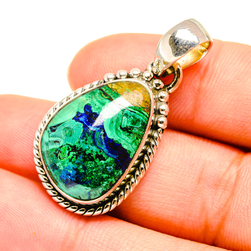 Oval sterling silver azurite pendant with blue-green stone and ornate bezel