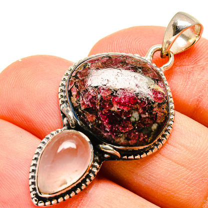 Oval gemstone pendant in silver-tone setting with red druzy center and pale rose quartz side