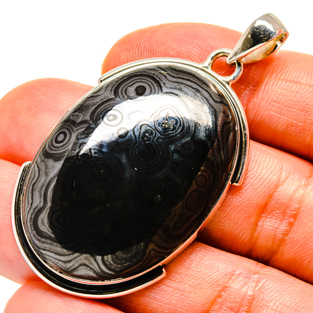 Psilomelane oval cabochon pendant with black-gray stone and 925 silver bail.