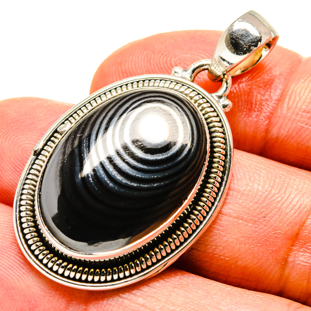 Oval psilomelane pendant with black-gray cabochon, beaded 925 silver frame