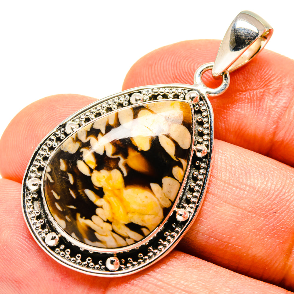 925 sterling silver jasper pendant on finger, pear-shaped dark stone with yellow pattern