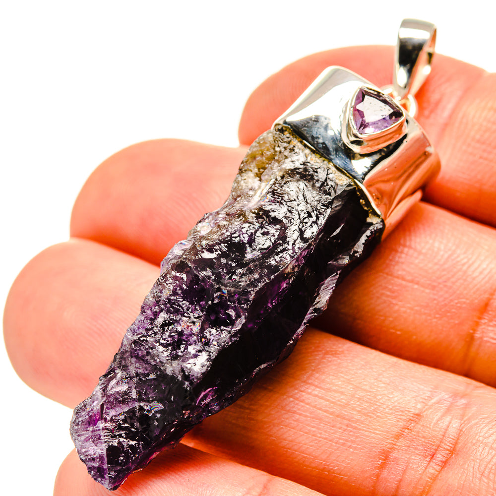 Amethyst stalactite pendant, 925 sterling silver, purple crystal point held in hand