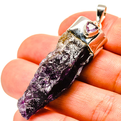 Amethyst stalactite pendant, 925 sterling silver, purple crystal point held in hand