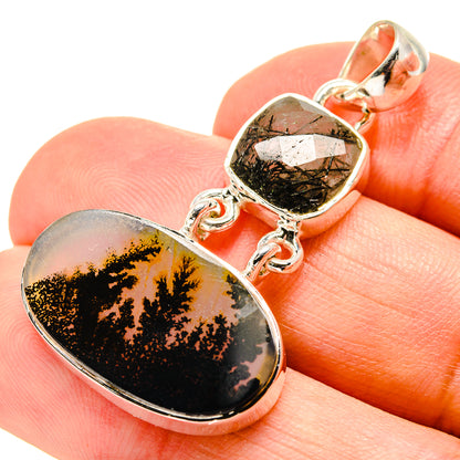 Oval gemstone pendant on bail with dendritic black pattern over gold, sterling silver