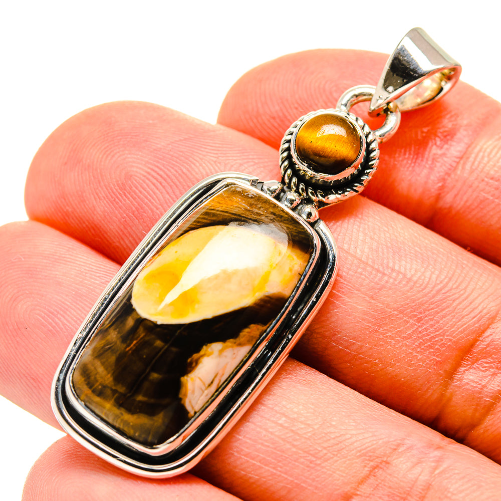 Rectangular tiger eye jasper pendant in silver-tone bezel, round bail top
