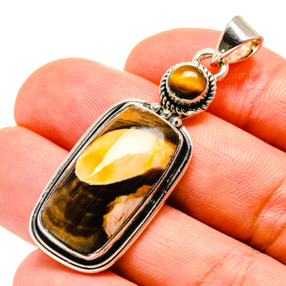 Rectangular tiger eye jasper pendant in silver-tone bezel, round bail top