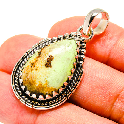 Sterling silver pendant with oval lemon-green chrysoprase cabochon and beaded frame