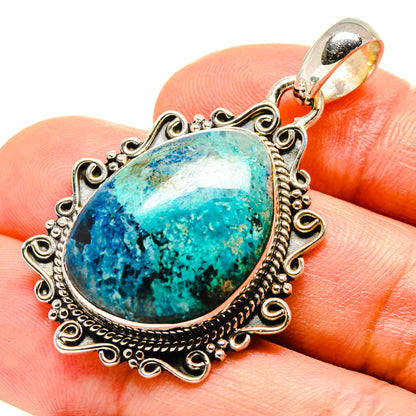 Chrysocolla pendant with oval turquoise-blue stone, decorative 925 sterling silver bezel