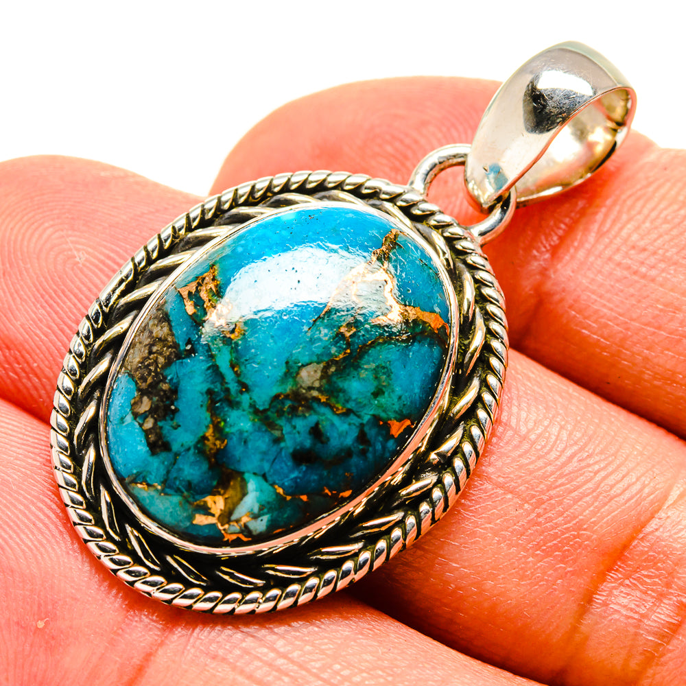 Oval turquoise pendant with rope-edge silver bezel and hinged bail, blue-green stone