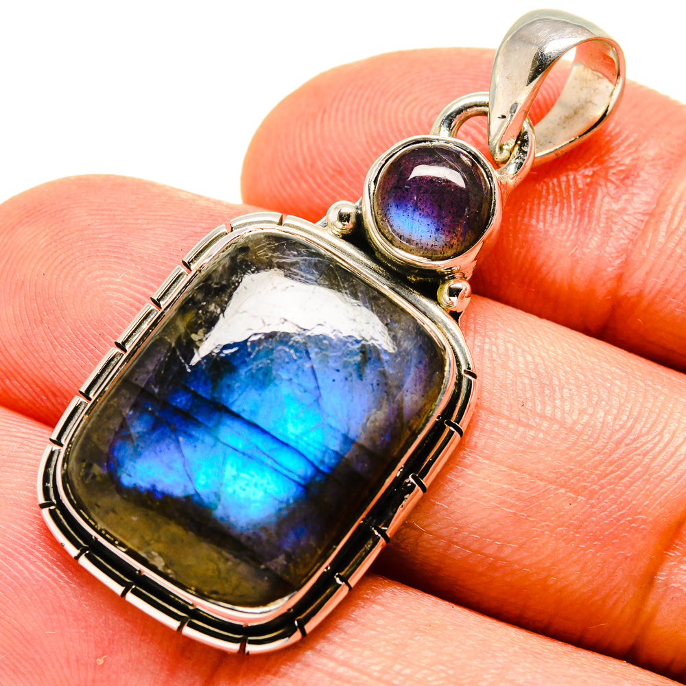 Labradorite pendant in 925 sterling silver with oval blue-flash stone and small cabochon