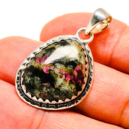 Russian eudialyte pendant in 925 sterling silver, round bezel with green and pink stone