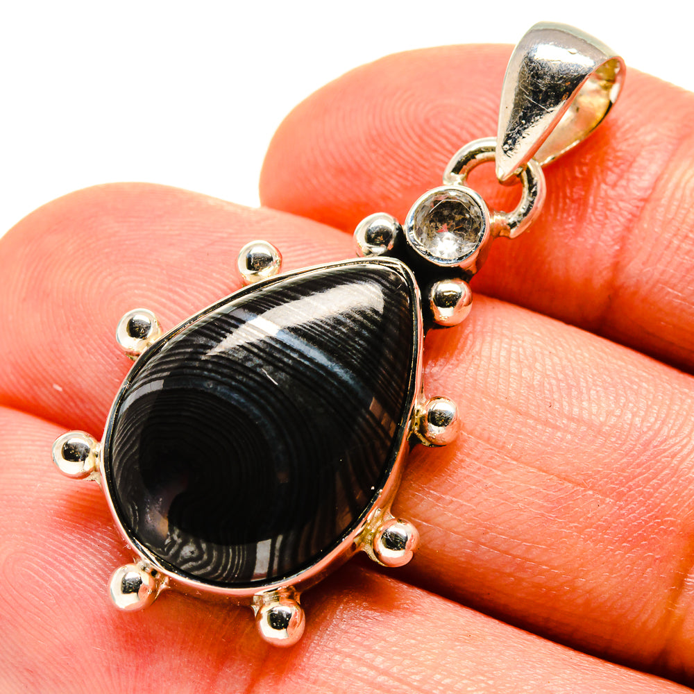Sterling silver pear-shaped pendant with black striped gemstone and round clear center