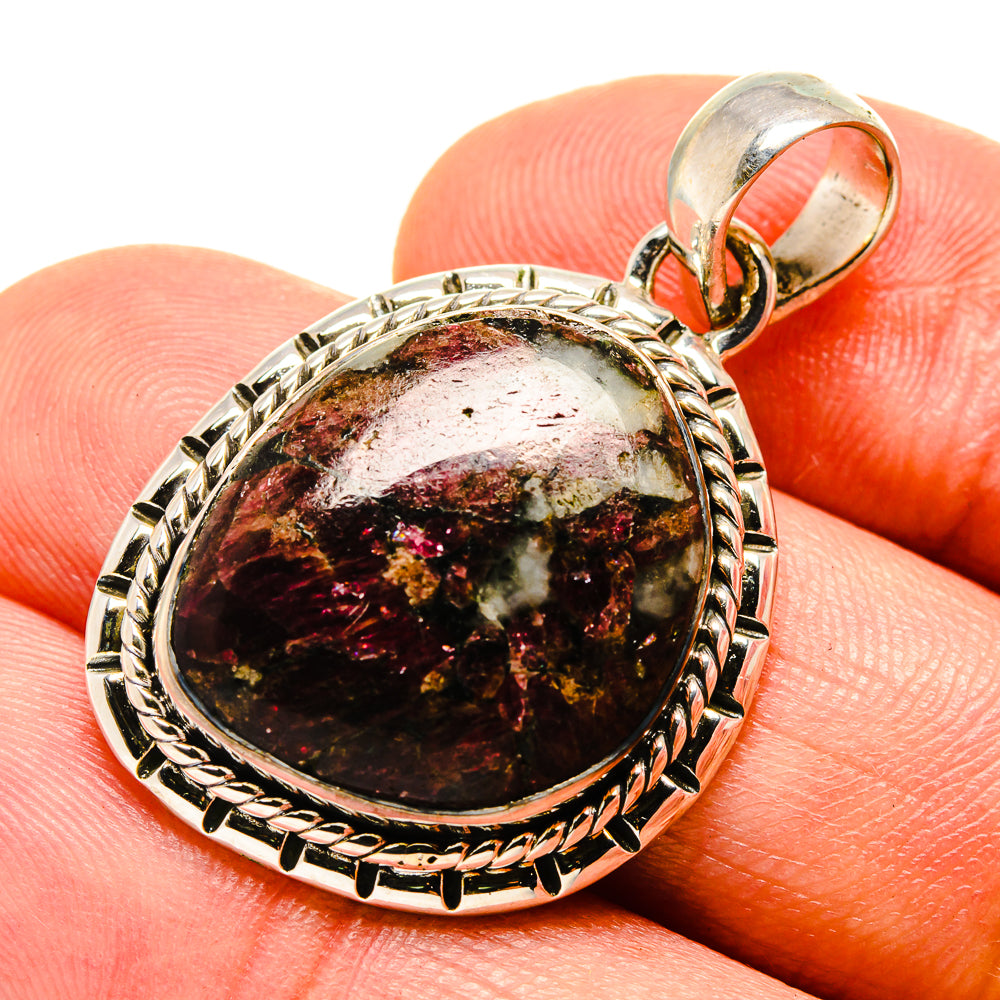 Russian eudialyte pendant, round cabochon with rope silver frame and top bail