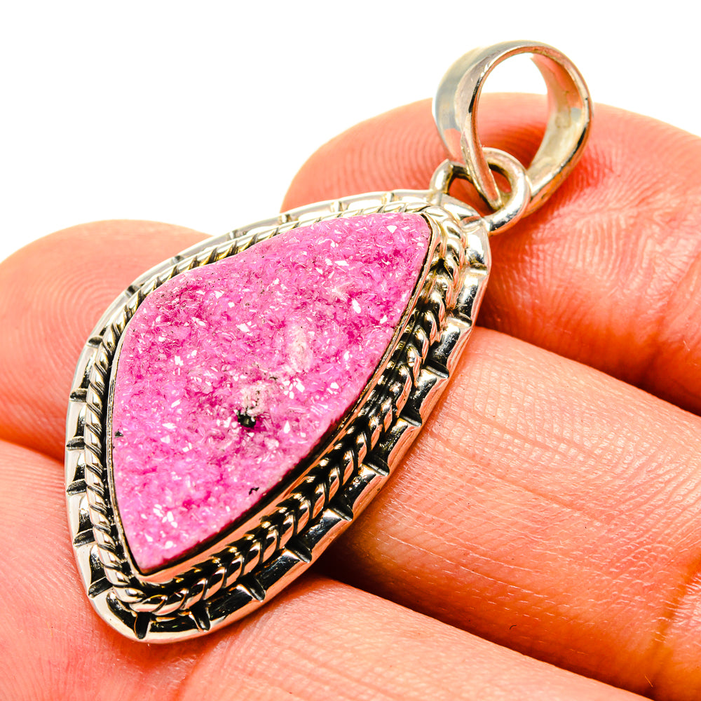 Pink druzy calcite pendant with teardrop bezel in silver-tone setting