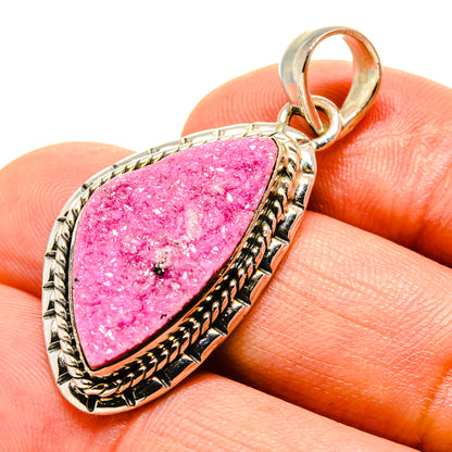 Pink druzy calcite pendant with teardrop bezel in silver-tone setting