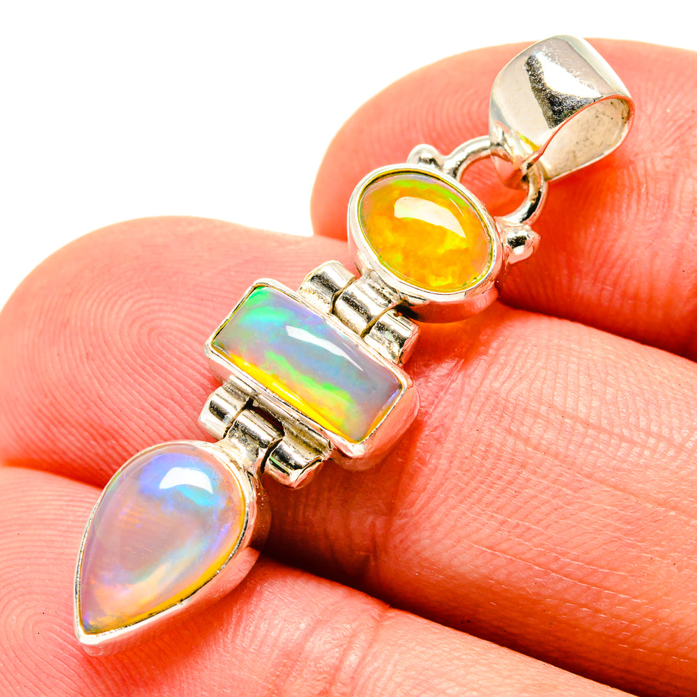 Sterling silver opal pendant with three yellow and rainbow gemstone drops