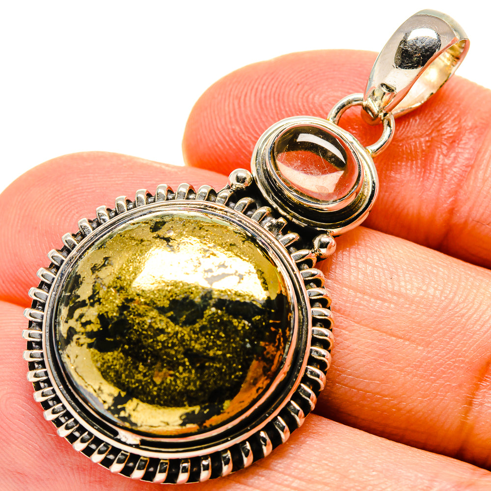 Round citrine agate pendant with gold-and-green speckled stone, sterling silver bezel.