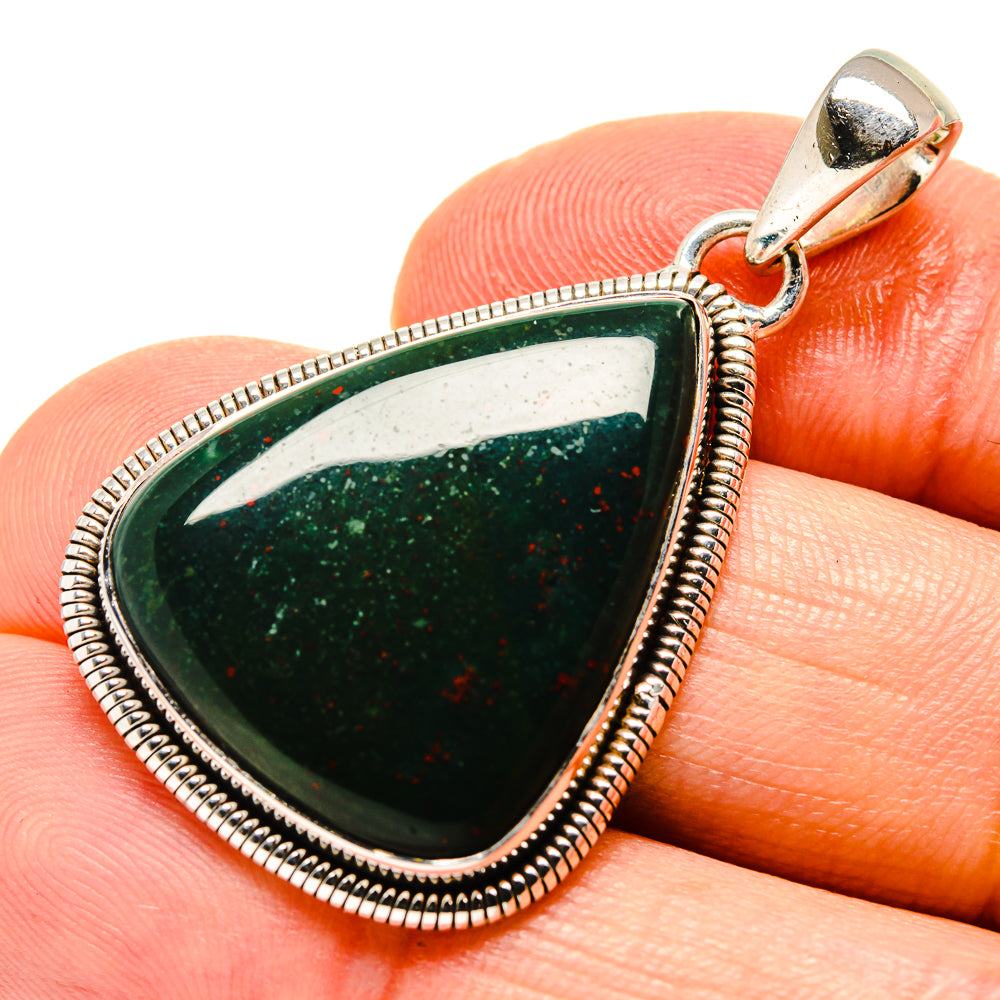 Bloodstone pendant: teardrop silver bezel with dark green stone and red specks, bail
