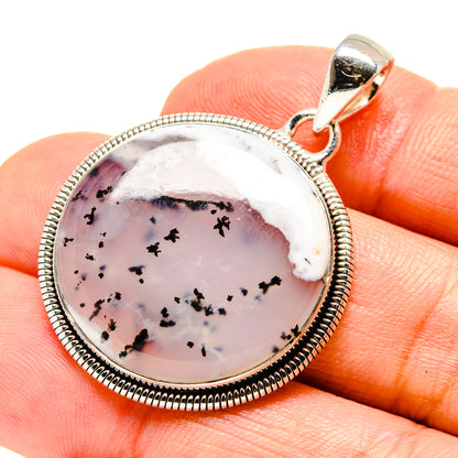 Sterling silver pendant with round dendritic opal cabochon in bead-bordered bezel