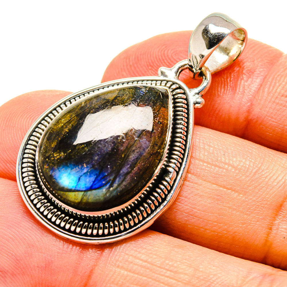 Labradorite pendant in oval sterling silver bezel with polished bail, blue-gold flash cabochon