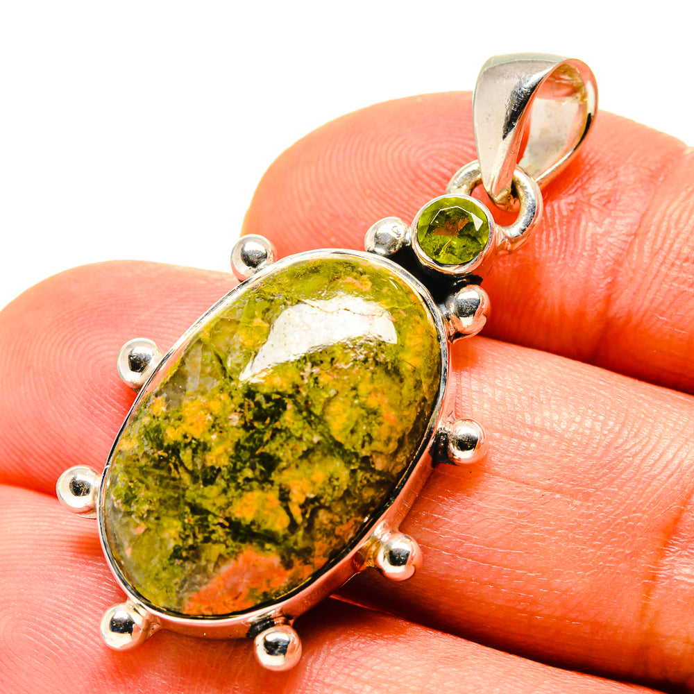 Oval unakite pendant on sterling silver prong setting, with green round accent stone