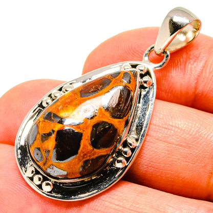 Bauxite teardrop pendant in silver-tone setting, top loop bail visible