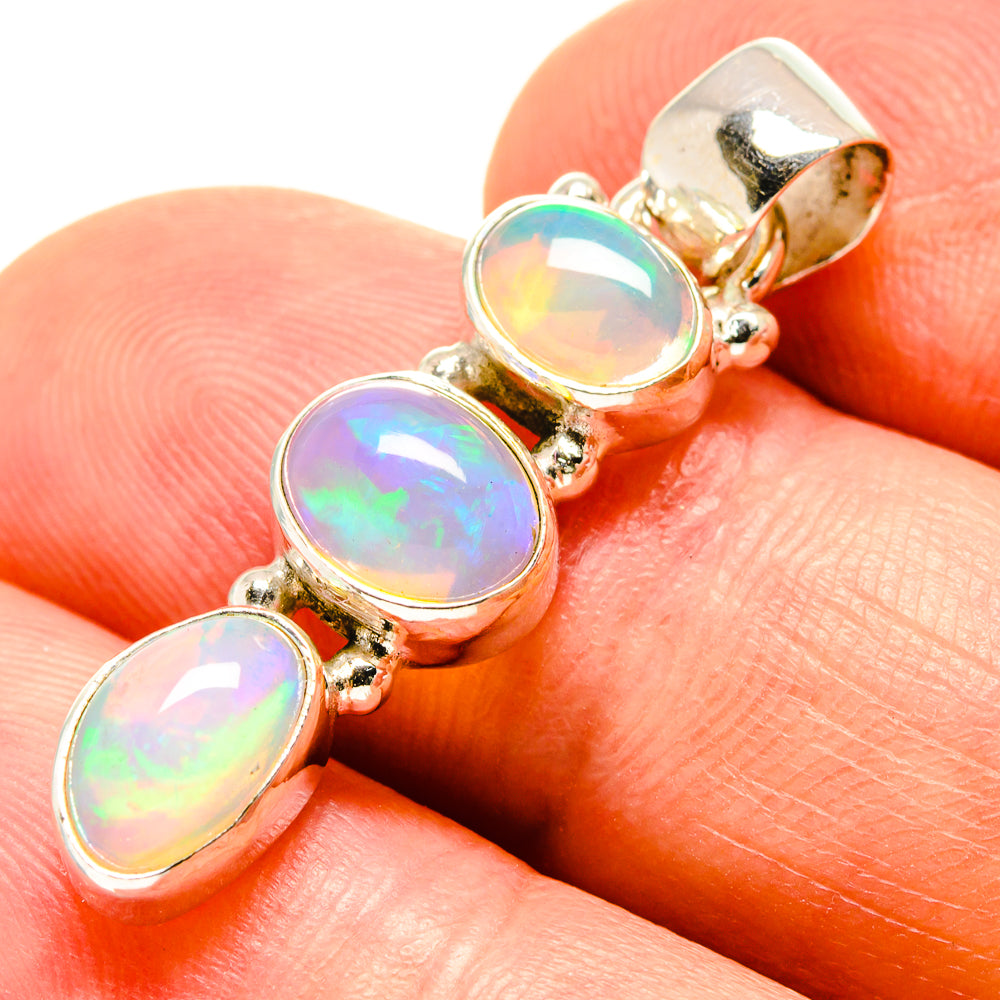 Ethiopian opal pendant with three oval cabochons in silver-tone bezel