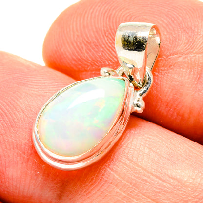 Sterling silver opal pendant close-up, milky opal teardrop cabochon and bail